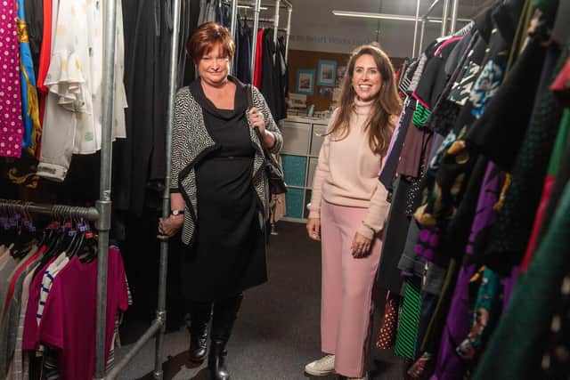 Client Sally, left, was gifted a Betty Jackson dress for her interview, pictured here with dressing volunteer Rachel, at the Smart Works Leeds centre.