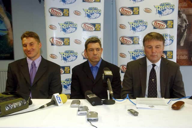 Daryl Powell, middle, hands over the Leeds Rhinos' coaching to Tony Smith, left, watched by chief executive Gary Hetherington in july 2003.