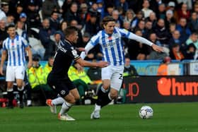 BATTLE: Danny Ward competes for the ball in Huddersfield Town's game against Millwall