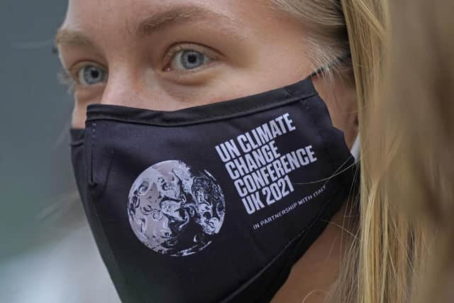 Activists wearing face masks as the COP26 summit begins in Glasgow.