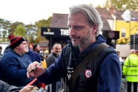 Heading for the exit: Barnsley manager Markus Schopp signs autographs before the match against Bristol City at Ashton Gate - which appears to be his final game in charge. Picture: Simon Galloway/PA