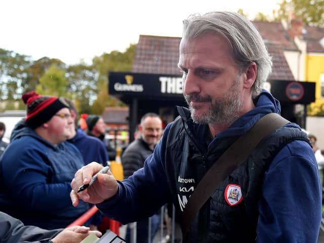 Heading for the exit: Barnsley manager Markus Schopp signs autographs before the match against Bristol City at Ashton Gate - which appears to be his final game in charge. Picture: Simon Galloway/PA