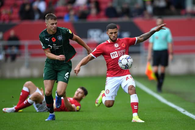 Barnsley's Mads Juel Andersen (left) and Bristol City's Nahki Wells battle for the ball at Ashton Gate, Bristol. Picture: Simon Galloway/PA