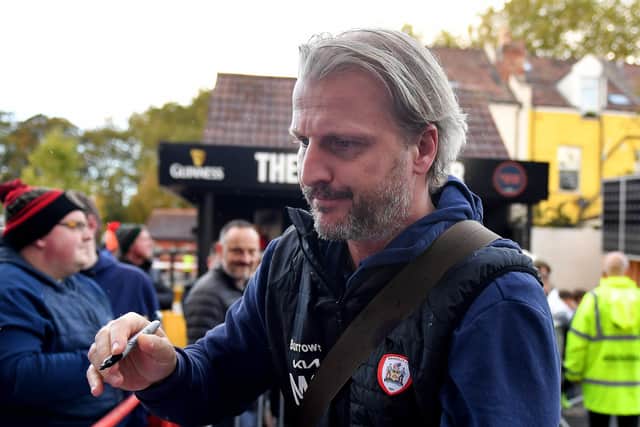 Barnsley manager Markus Schopp signs autographs ahead of Saturday's match against Bristol City at Ashton Gate. Picture: Simon Galloway/PA