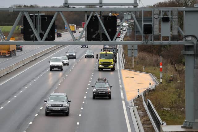 Traffic passes an Emergency Refuge Area on a smart motorway section