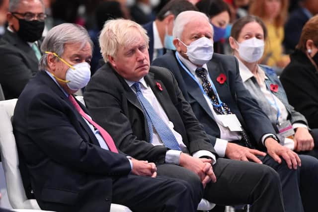 Secretary-General of the United Nations António Guterres, British prime Minister Boris Johnson and Sir David Attenborough attend the opening ceremony of the UN Climate Change Conference COP26 at SECC on November 1, 2021 in Glasgow. (Photo by Jeff J Mitchell/Getty Images).