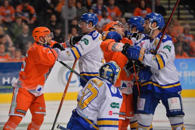 UNTIL NEXT TIME: Players from Sheffield Steelers and Fife Flyers - including Robert Dowd (far left) - have a few words with each other 

around the visitors' net during last month's encounter in Sheffield. Picture: Dean Woolley/EIHL.