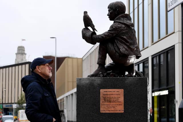 The Barry Hines Kes Statue is put in place at Cheapside, Barnsley - Graham Ibbeson is pictured with his sculpture  Picture: Simon Hulme