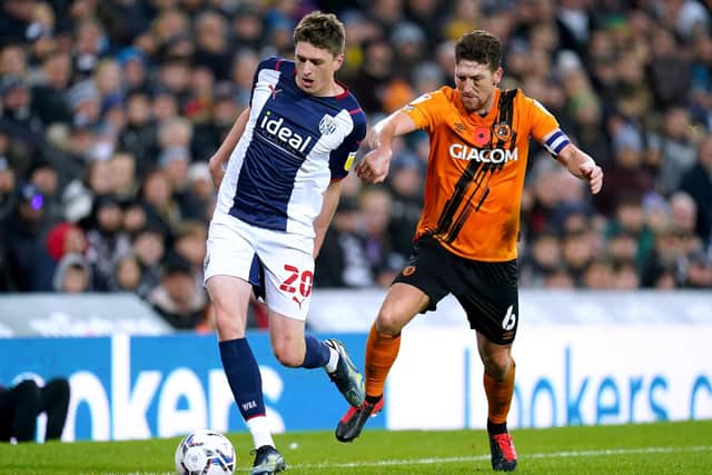 West Bromwich Albion's Adam Reach (left) and Hull City's Richard Smallwood battle for the ball (Picture: PA)