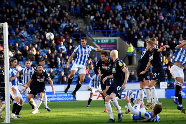 Jonathan Hogg (right) scores the winning goal for Huddersfield against Millwall (Picture: Simon Hulme)