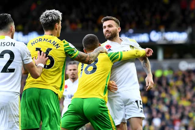 Norwich City v Leeds United - Stuart Dallas clashes with Mathias Normann and Christos Tzolis. (Picture: Simon Hulme)