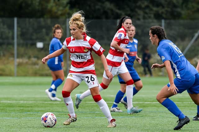 Sophie Scargill, left, in action for Doncaster Rovers Belles, who she suffered a serious knee injury training with.