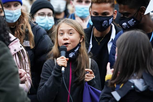 Greta Thunberg alongside fellow climate activists during a demonstration at Festival Park, Glasgow, on the first day of the COP26 summit.