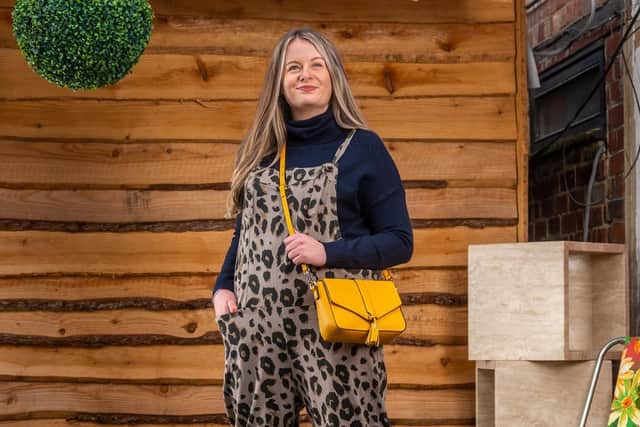 Robin Gifts owner Zoe Wotherspoon wears navy rollneck jumper, £37; leopard dungarees, £27; crossbody bag, £39, all from Robin Gifts at 53 Bo' Grove, Harrogate.