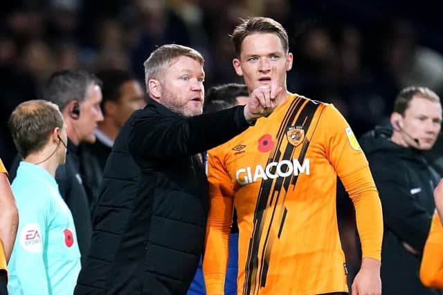 Hull City manager Grant McCann speaks to Sean McLoughlin during the Sky Bet Championship match at The Hawthorns (Picture: PA)