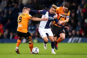 West Bromwich Albion's Callum Robinson (centre) battles for the ball with Hull City's Greg Docherty (left) and Richard Smallwood on Wednesday (Picture: PA)