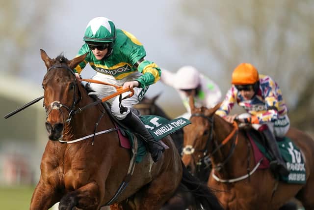 Minella Times and Rachael Blackmore surge clear to win the Grand National.