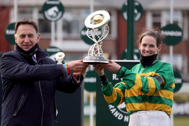 The history-making Rachael Blackmore celebrates the Randox Health Grand National win of Minella Times at Aintree in April with trainer Henry de Bromhead (left).