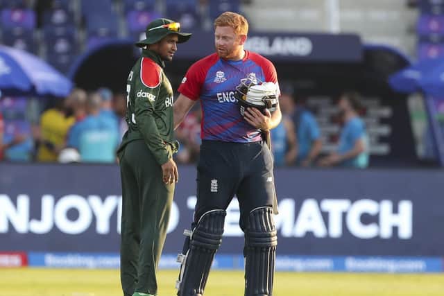 England's Jonny Bairstow, right, talks with Bangladesh's Shakib Al Hasan. (AP Photo/Aijaz Rahi)