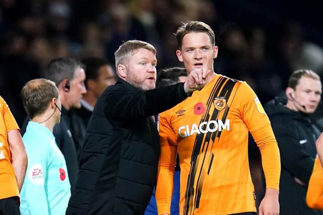 Hull City manager Grant McCann speaks to Sean McLoughlin during Wednesday's match against West Brom at The Hawthorns. Picture: Nick Potts/PA
