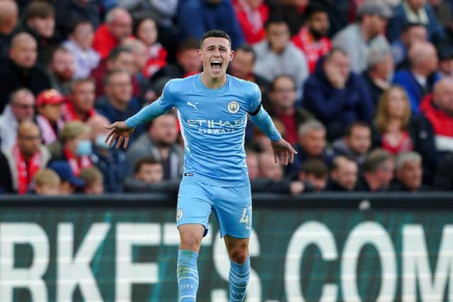 Manchester City's Phil Foden celebrates scoring their side's first goal of the game during the Premier League match at Anfield, Liverpool. (Picture: PA)