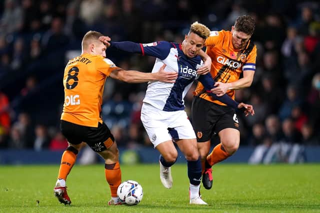 West Bromwich Albion's Callum Robinson (centre) battles for the ball with Hull City's Greg Docherty (left) and Richard Smallwood at The Hawthorns. Picture: Nick Potts/PA
