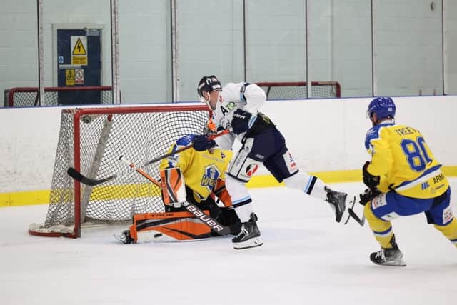 Ben Churchfield (orange pads) in action for Leeds Knights against Sheffield Steeldogs last month. Picture courtesy of Peter Best.