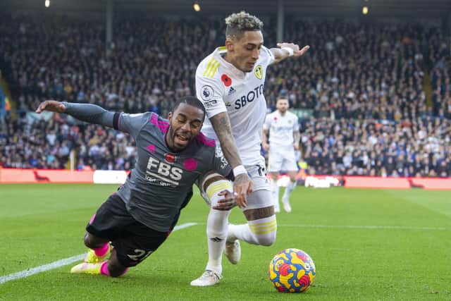 Leeds United's Raphinha goes down in the box from the challenge by Foxes' Ricardo Pereira.  Picture Tony Johnson