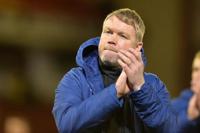 Hull City head coach Grant McCann claps visiting supporters after his side's 2-0 win at Oakwell. Picture: Bruce Rollinson.