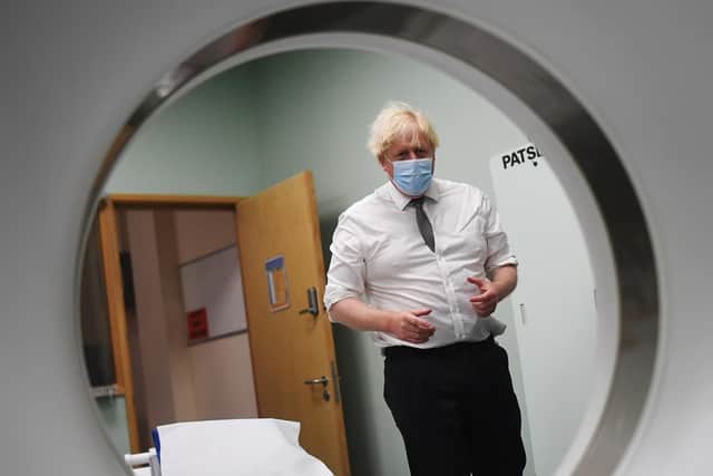 Prime Minister Boris Johnson is shown around a CT scan room during a visit to Hexham General Hospital in Northumberland (PA)