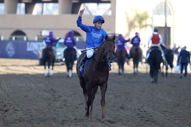Jockey William Buick celebrates aboard Yibir after winning the Breeders' Cup Turf at Del Mar.