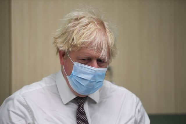 In a hole - Boris Johnson chose to visit a hospital in Hexham rather than attend Parliament's emergency debate on standards and sleaze.