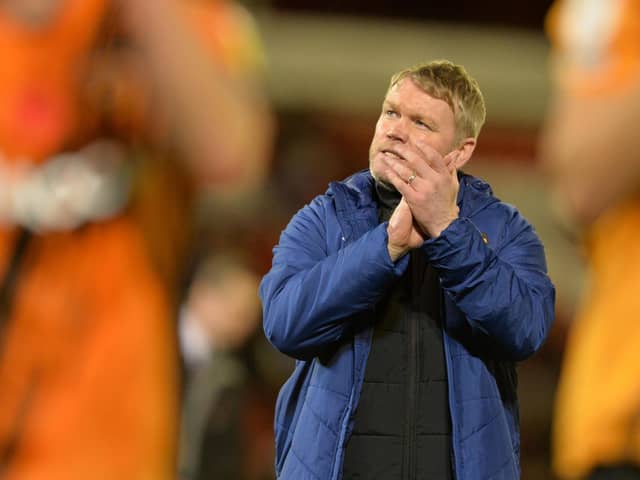 Hull City head coach Grant McCann claps fans after City's win at Oakwell on Saturday. Picture: Bruce Rollinson.