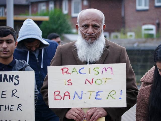 People take part in a protest outside Yorkshire County Cricket Club's Headingley Stadium in Leeds, in support of former county player Azeem Rafiq, after he spoke out about the racism and bullying he suffered over two spells at Yorkshire.