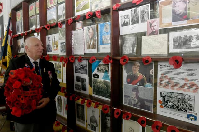 Ron Moffett MBE, a Poppy Appeal organiser for the Royal British Legion for Rotherhan West, stood looking at the Wall of Remembrance at Rotherham Market. Picture: Gary Longbottom.
