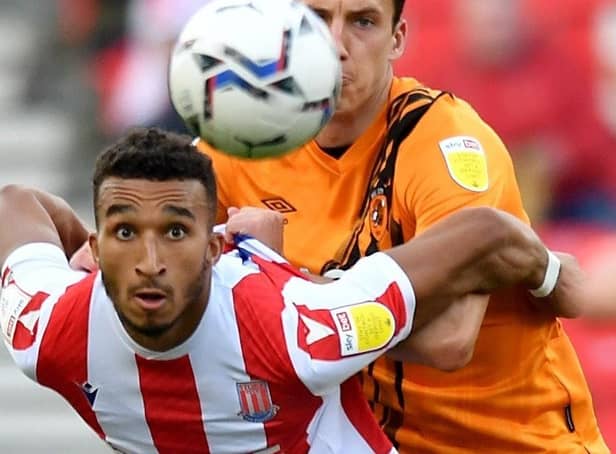 Stoke City's Jacob Brown and Hull City's Alfie Jones battle for the ball. Picture: PA