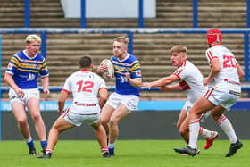 Ben Sheils, with ball, has left Rhinos' academy to sign for Sheffield. Picture by Craig Hawkhead Photography/Leeds Rhinos.