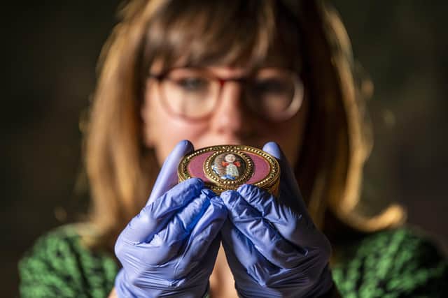 Registrar and collections manager Sarah Murray at Temple Newsam House in Leeds with one of the stolen 18th Century golden snuff boxes. Picture Tony Johnson