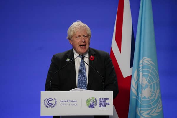 Prime Minister Boris Johnson holds a press conference at the Cop26 summit
