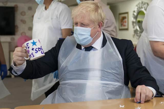 Library image of Prime Minister Boris Johnson during a visit to Westport Care Home in Stepney Green, east London,