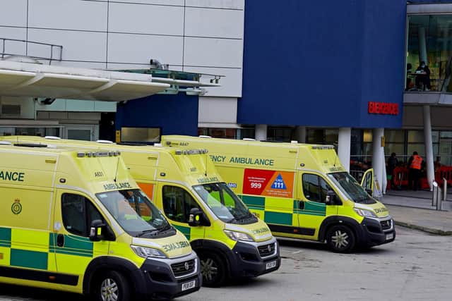 Ambulances parked outside an accident and emergency department  waiting for beds to become available for patients - all leading to huge delays answering 999 calls.