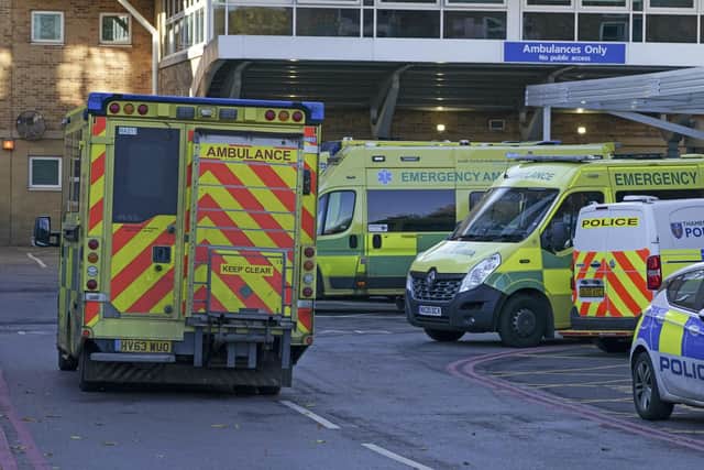 Ambulances parked outside an accident and emergency department  waiting for beds to become available for patients - all leading to huge delays answering 999 calls.