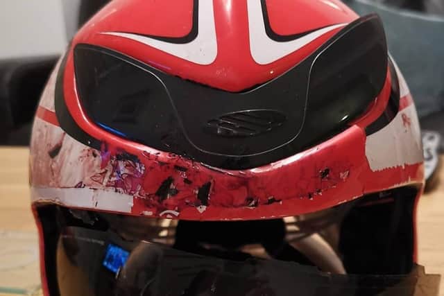 The damage done to Jorge's bike helmet