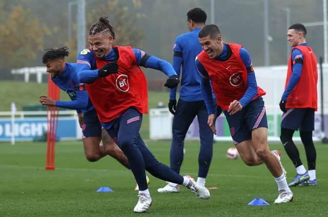 Kalvin Phillips and Conor Coady of England take part in a sprinting exercise during a training session at St George's Park. (Photo by Eddie Keogh - The FA/The FA via Getty Images)