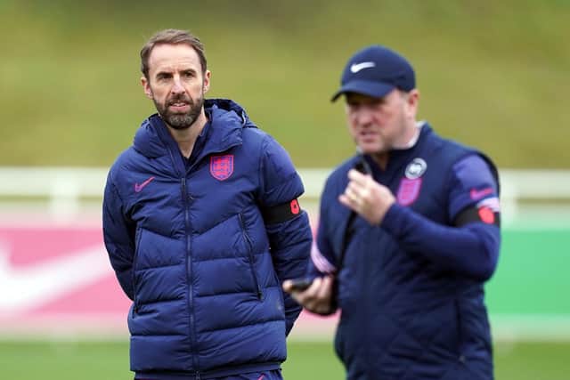 England manager Gareth Southgate and assistant Steve Holland (right) during a training session at St George's Park. Picture: PA