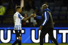JOB WELL DONE: Sheffield Wednesday defender Liam Palmer and manager Darren Moore congratulate each other after the 3-0 win over Sunderland   Picture: Steve Ellis