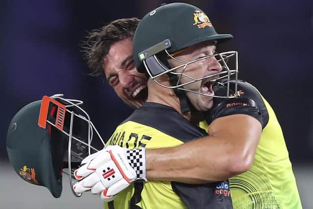 Australia's Marcus Stoinis, holding helmet, and Matthew Wade celebrate after winning the Cricket Twenty20 World Cup semi-final match between Pakistan and Australia in Dubai. (AP Photo/Kamran Jebreili)