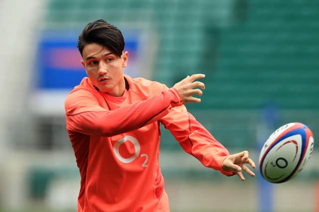 PREPARATIONS: Marcus Smith of England offloads the ball during a training session at Twickenham Stadium. Picture: Getty Images.