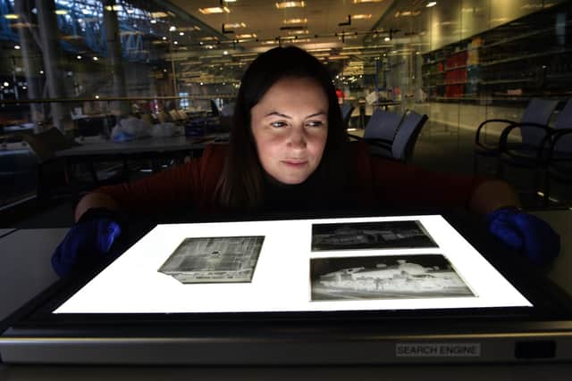 National Railway Museum archives manager Alison Kay views some of the 14 glass plate negatives taken by George Stainton (1852-1926). Picture: Jonathan Gawthorpe