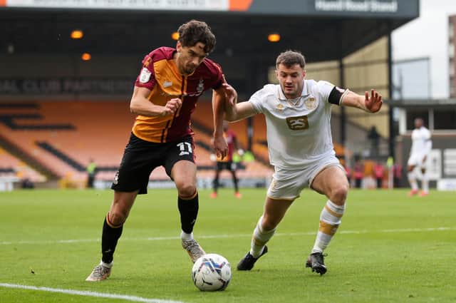 Action from Bradford's game at Port Vale. Picture: PA.